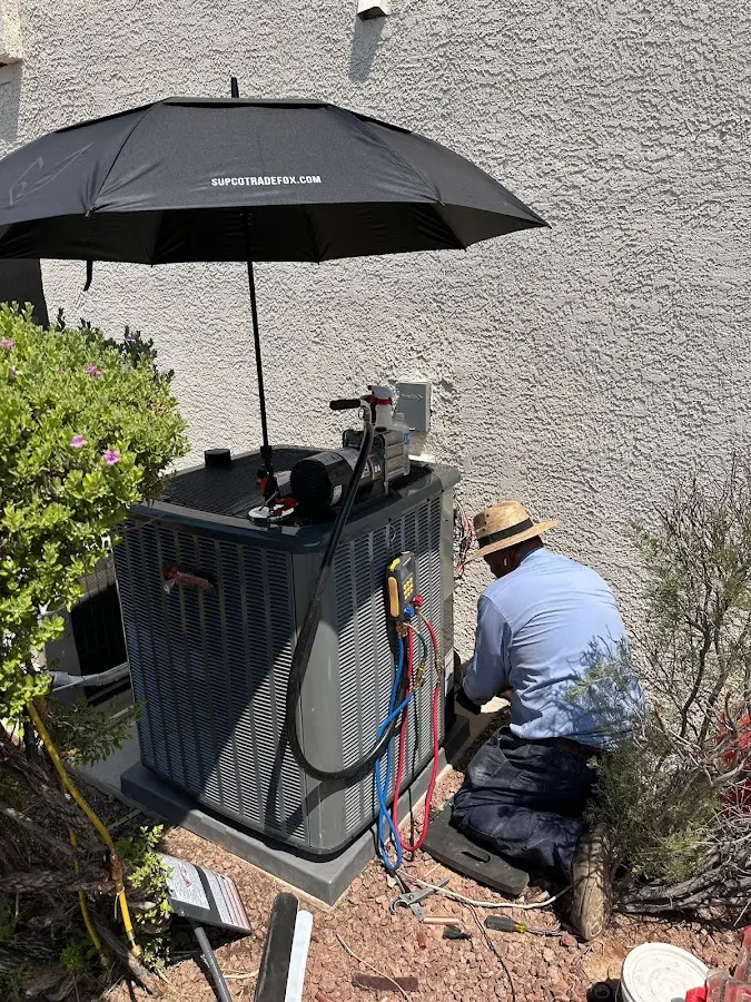 HVAC technician performing outdoor AC maintenance in Canyon Lake